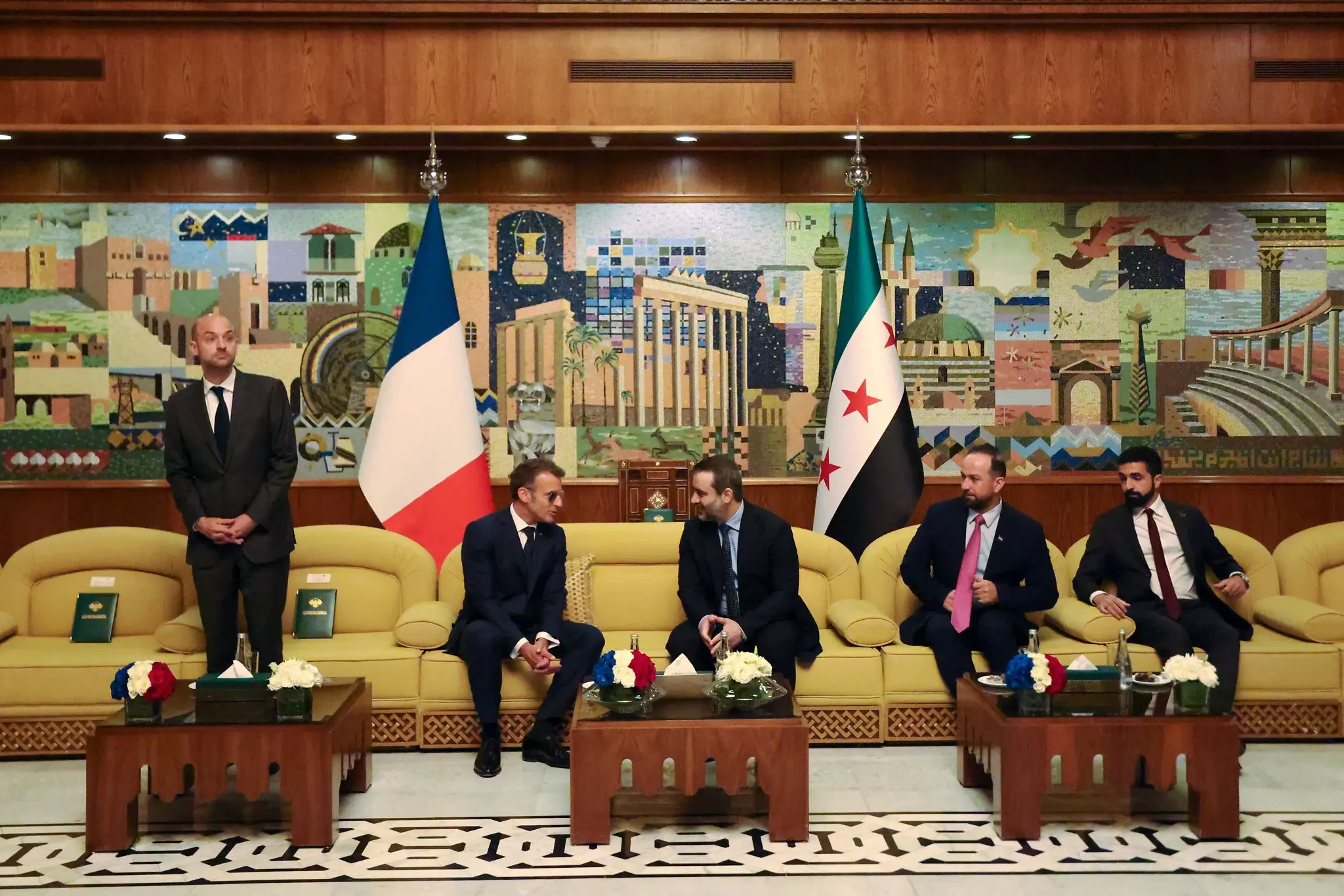 Macron Pledges Support for Syria's Economic Rebuilding Despite Blasts